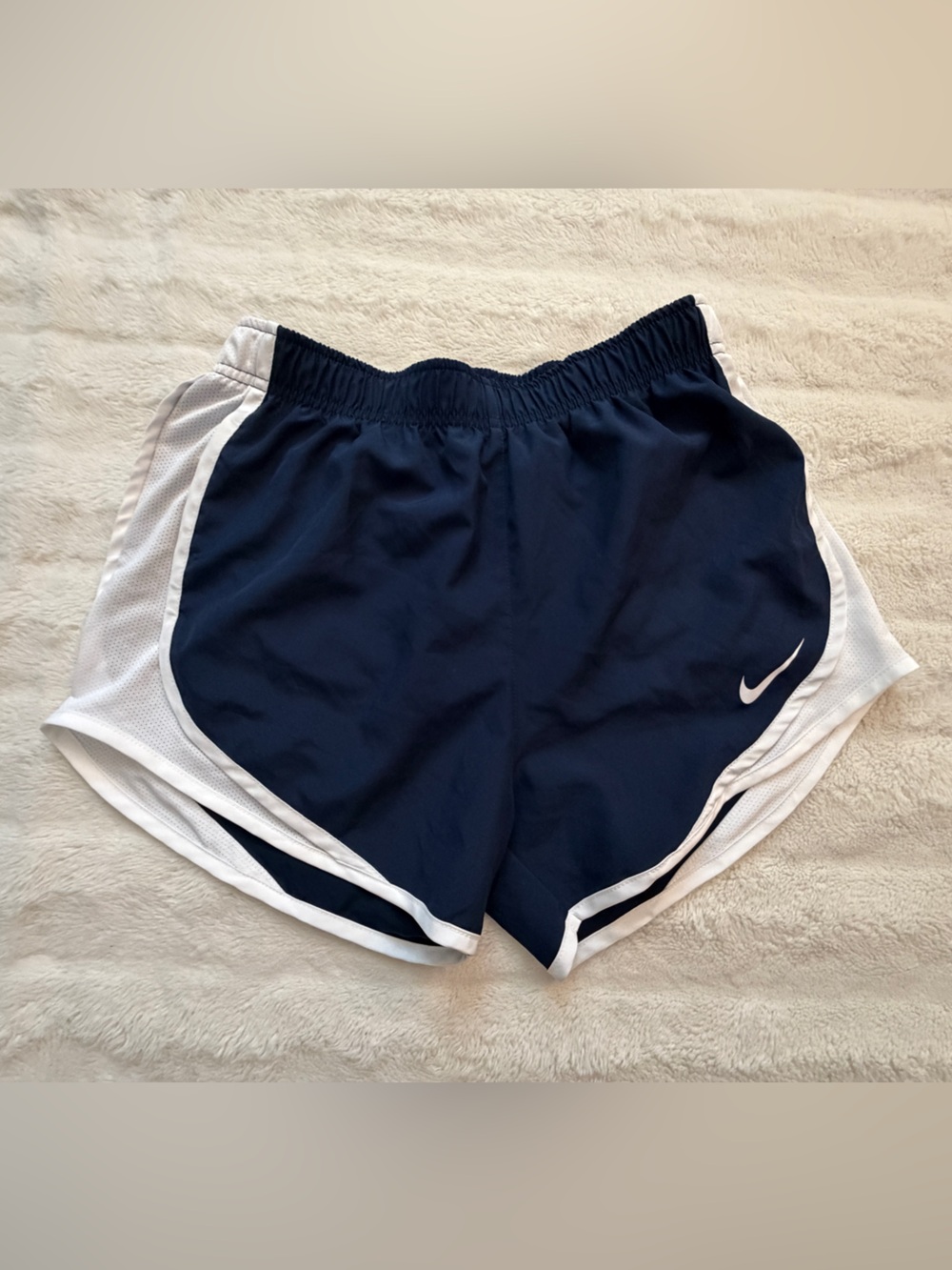 Woman’s Nike white and Navy Dri-FIT Athletic Shorts